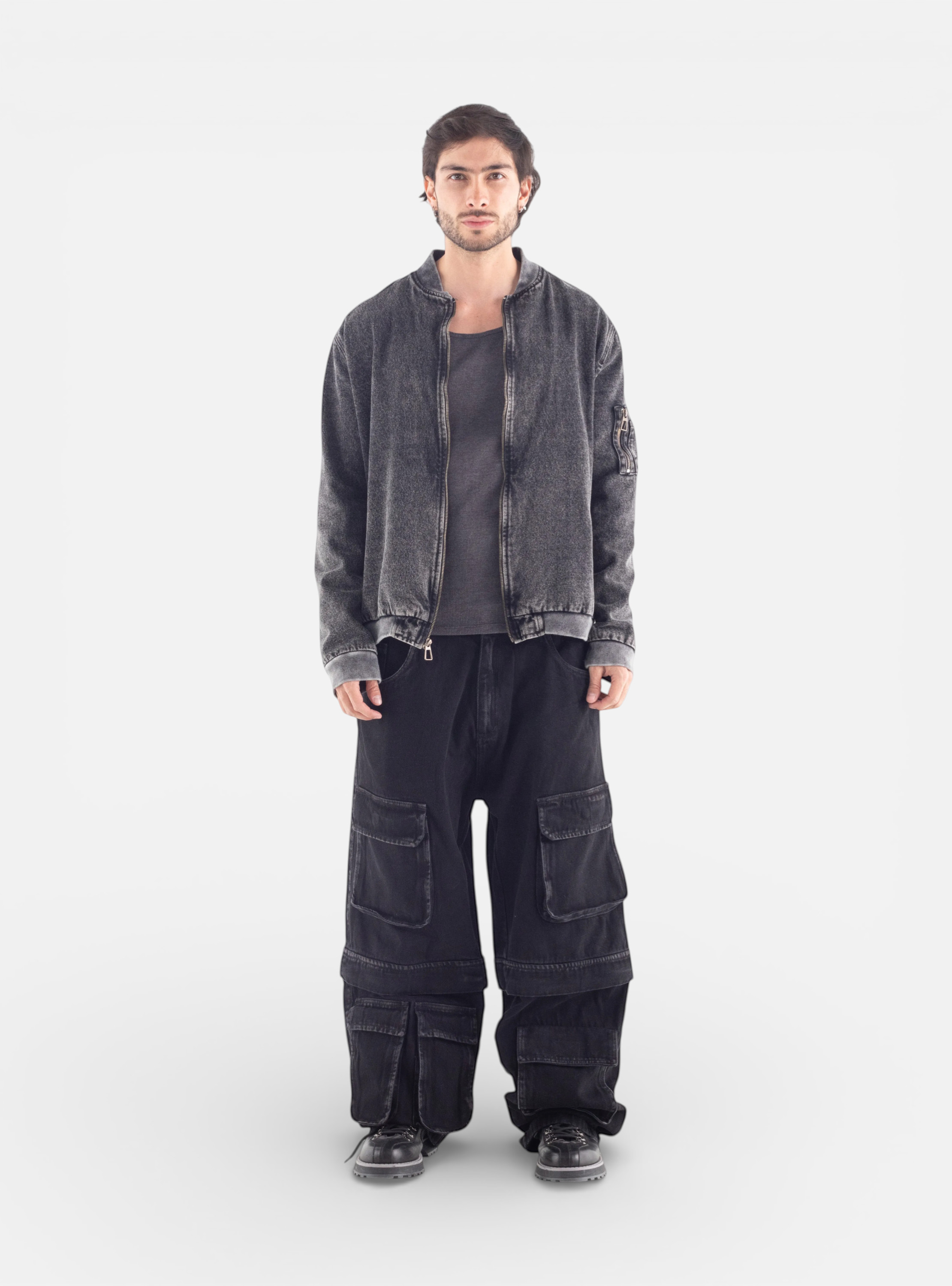 Fxckboy relaxed fit black denim utility pants with multiple cargo pockets and zip-off legs for urban shorts option.
