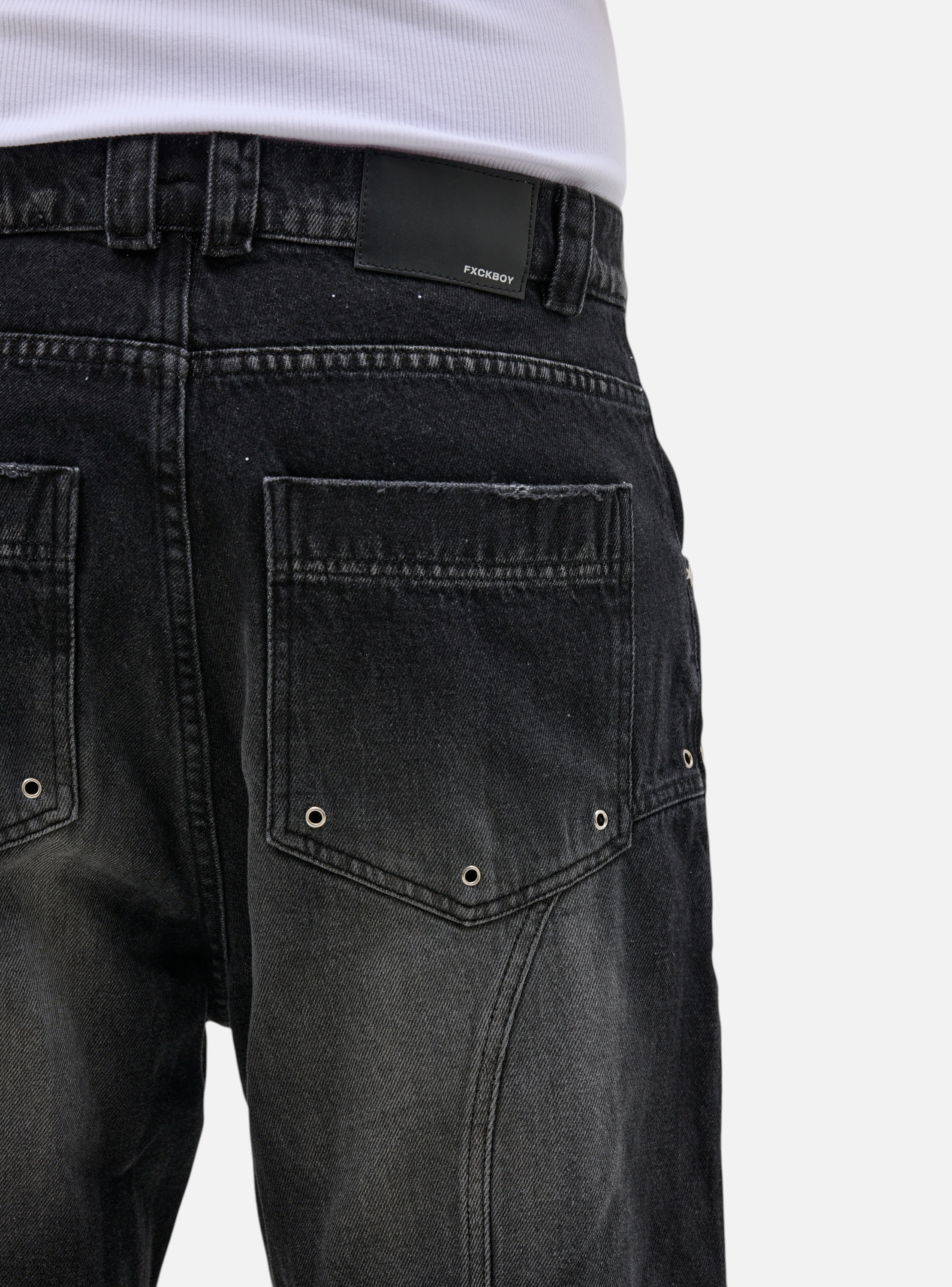 Fxckboy dark grey relaxed fit denim jeans with faded wash and technical design details.