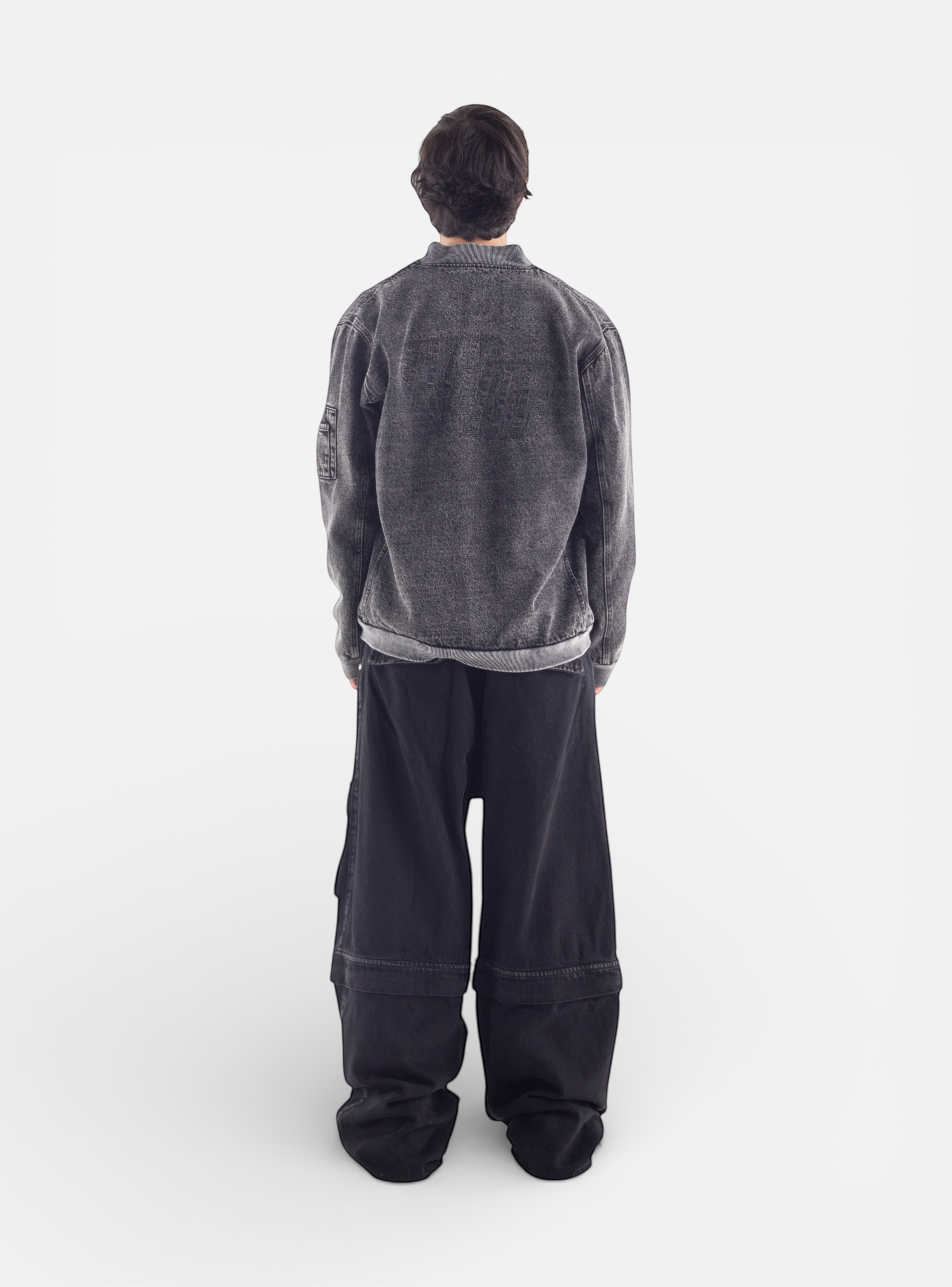 Fxckboy dark grey washed denim utility jeans with detachable legs and large cargo pockets.