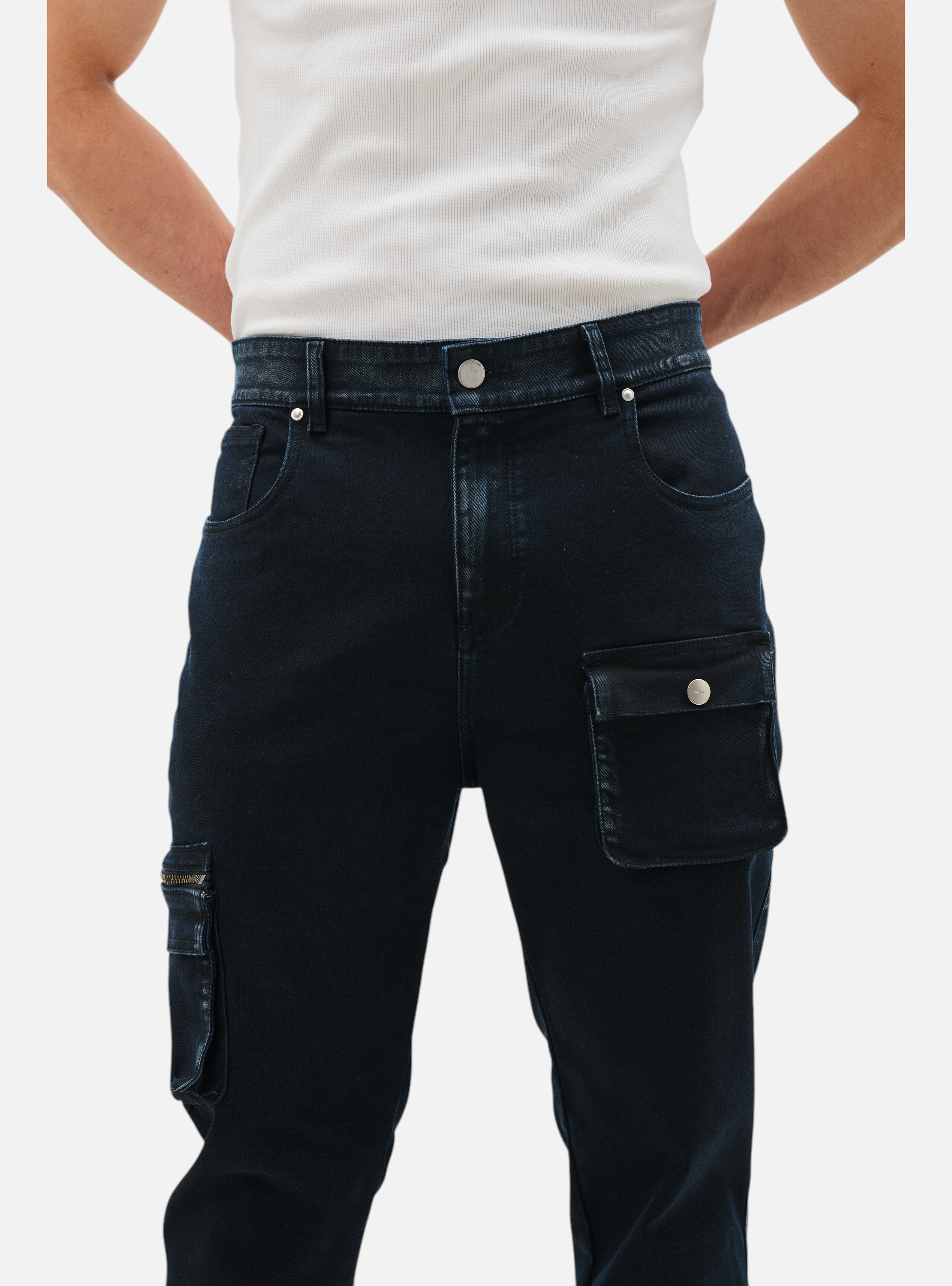 Fxckboy dark wash skinny fit jeans with cargo pockets and zipper detail.